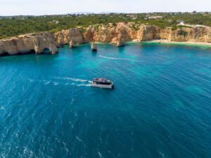 Modern catamaran cruising in Albufeira