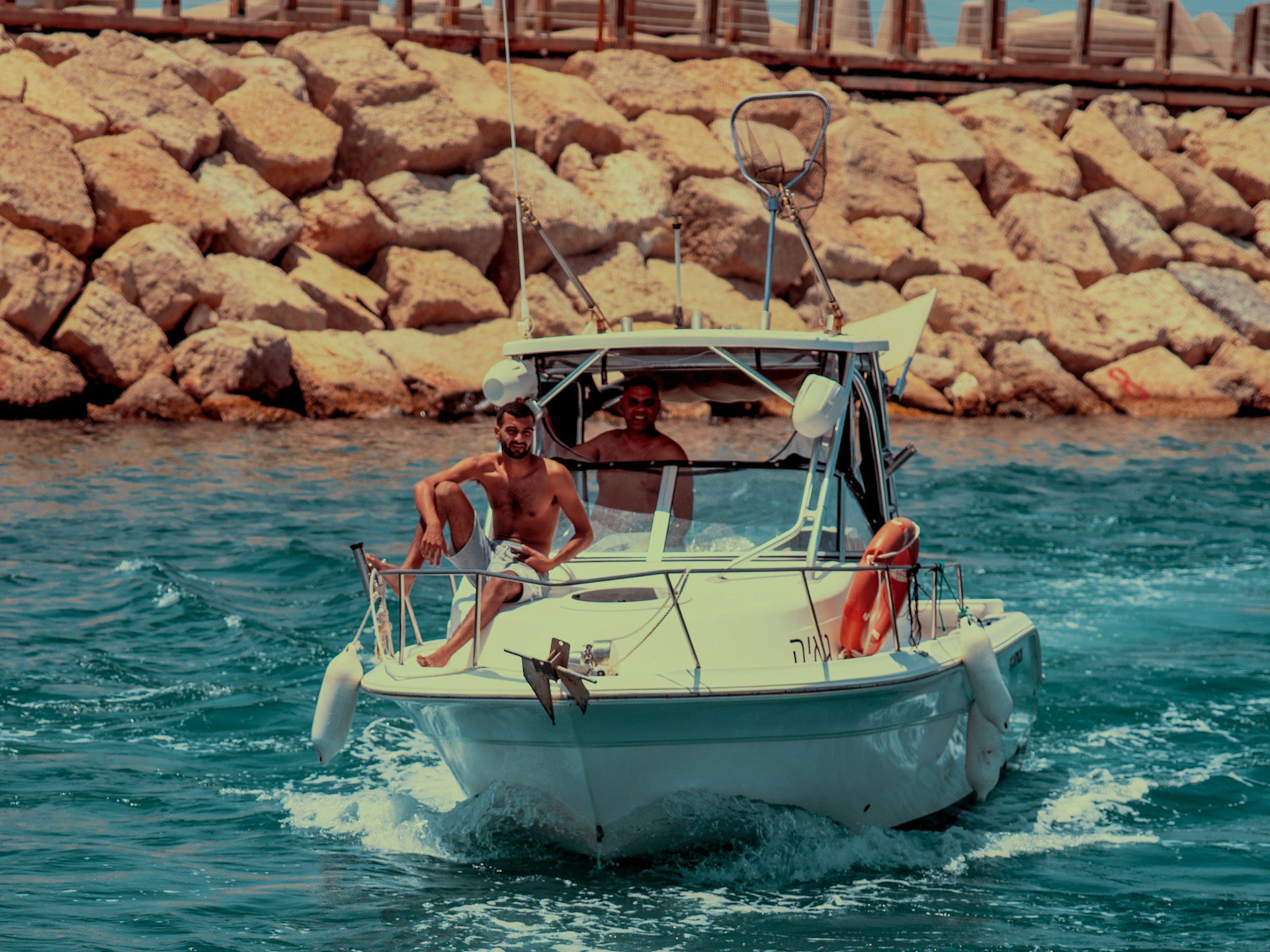 Boat charter A family enjoying a day out on a motorboat on open water