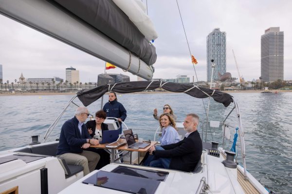 People enjoying a drink on a beautiful sailing yacht in Barcelona