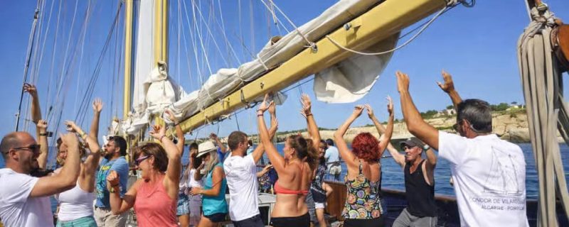 People dancing on a wooden sailing boat in Vilamoura