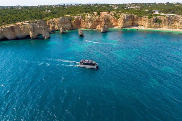 Modern catamaran cruising in Albufeira