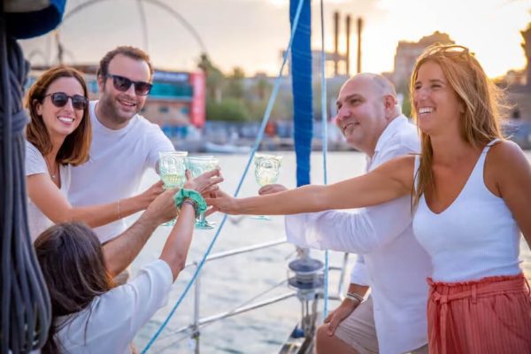 People enjoying a glass of wine on a sailing yacht in Barcelona