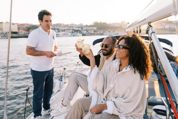People toasting on a sailing tour in Porto