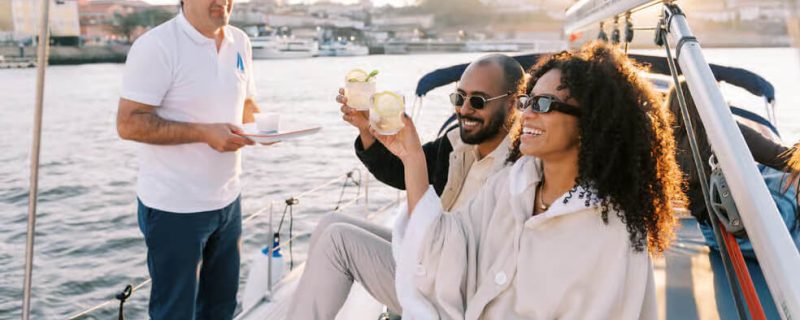 People toasting on a sailing tour in Porto
