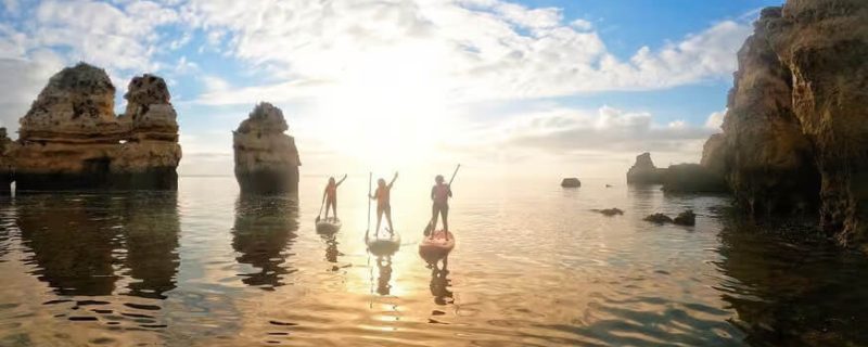 Three people on Stand up paddle boards in Lagos